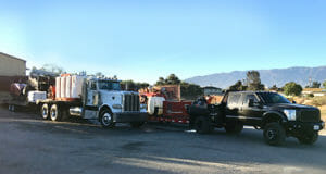 Two trucks at a construction site