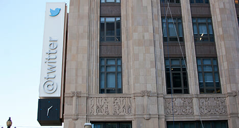 An office building with a twitter logo on the side - Design-build Project 