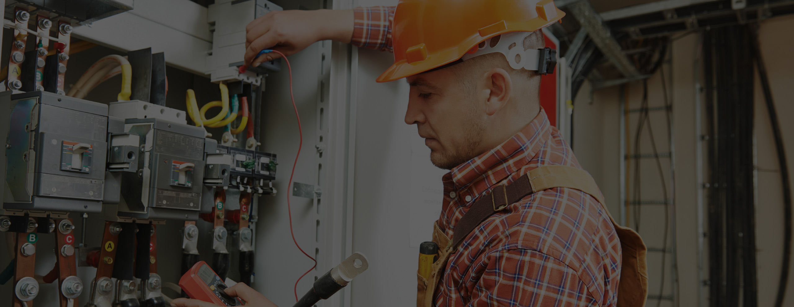 man working on electrical panel