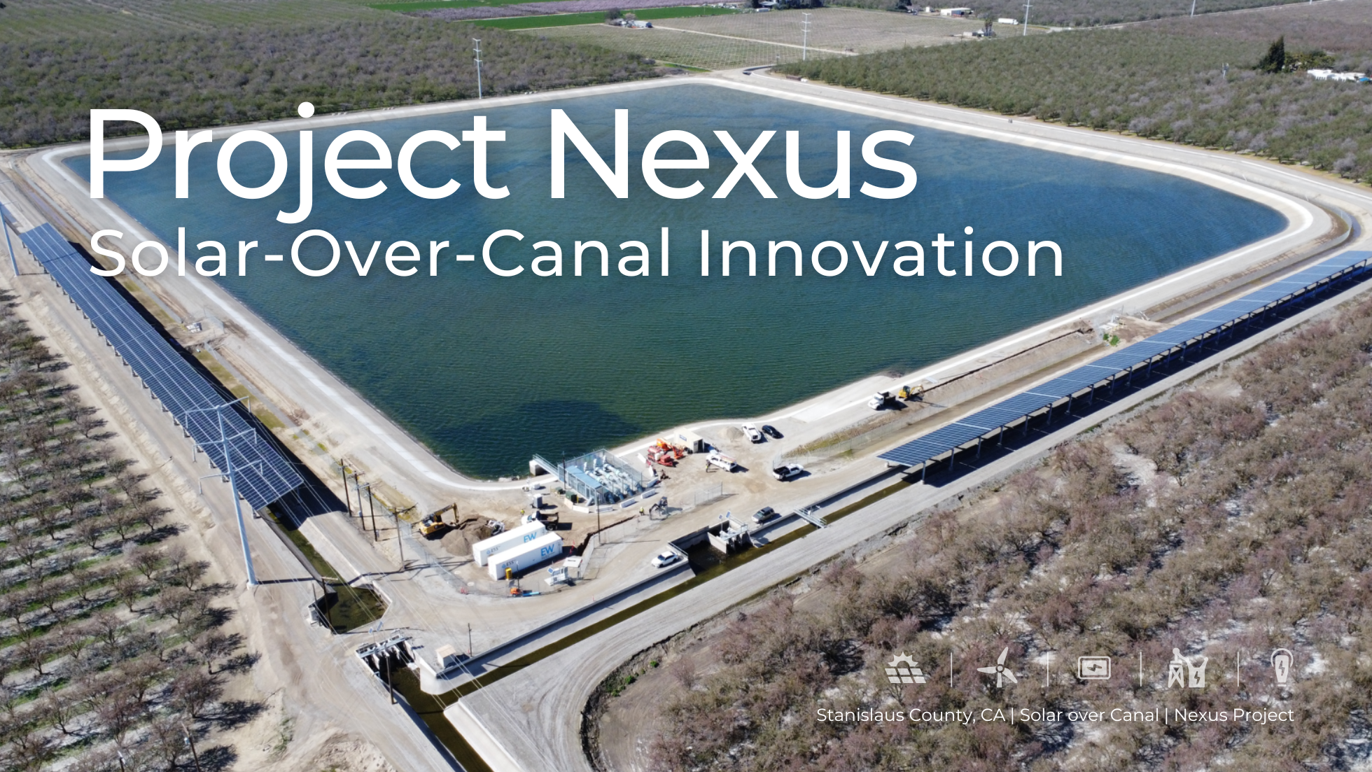 Aerial view of Project Nexus, a solar-over-canal installation in Stanislaus County, California. The image shows solar panel arrays mounted over irrigation canals surrounding a large water reservoir. Construction vehicles and equipment are visible on-site, highlighting the infrastructure work underway. The text overlay reads "Project Nexus: Solar-Over-Canal Innovation."